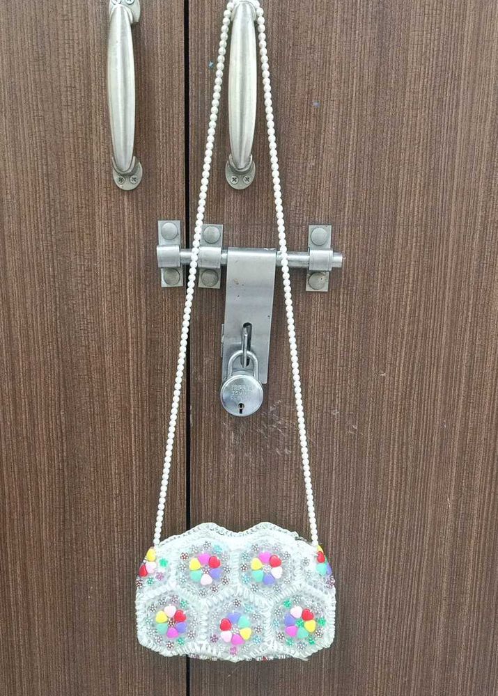 A Sling Bag With Pearls