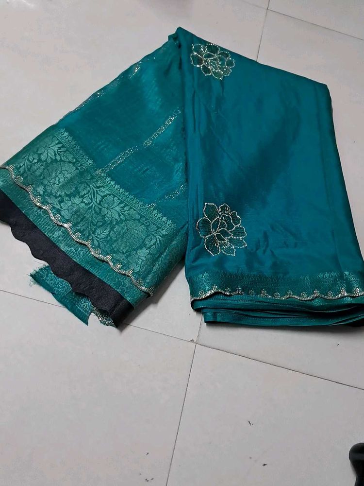 Elegant Teal Saree with Floral Detail