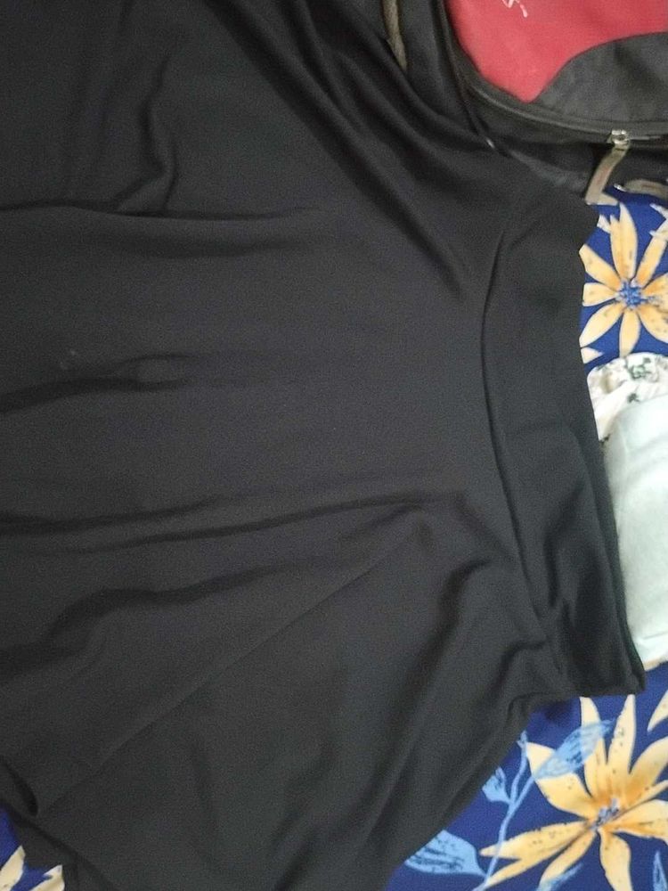 a black skirt with attached shorts inside