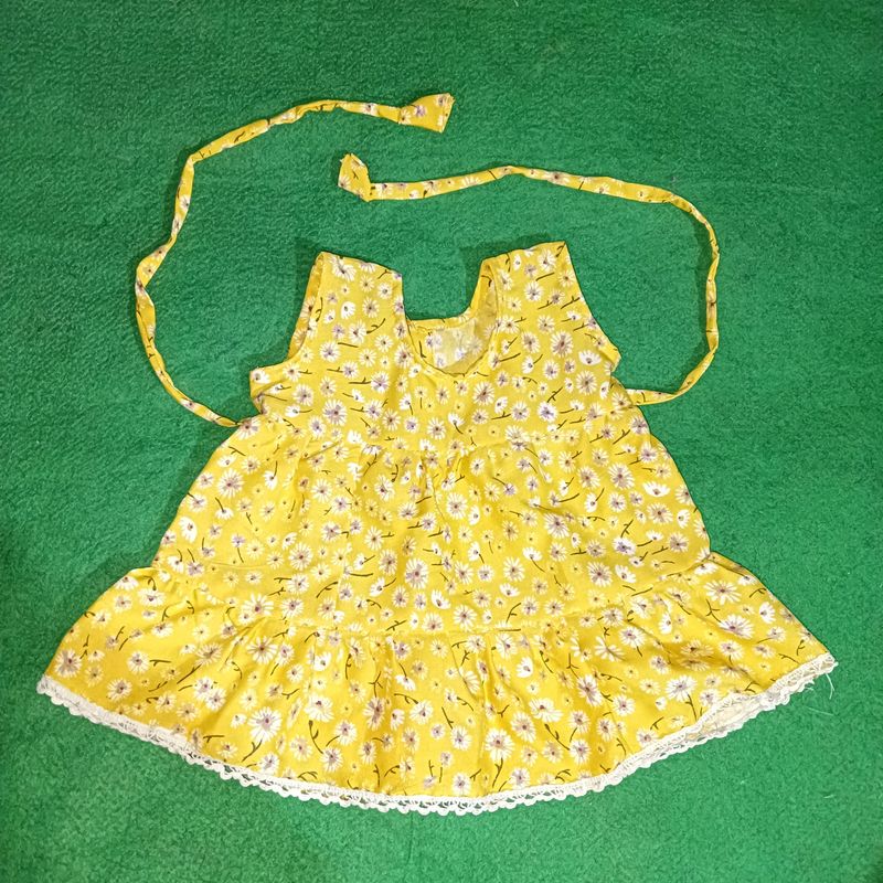 Handmade Flower Printed Yellow Baby Frock, Stitched At Home
