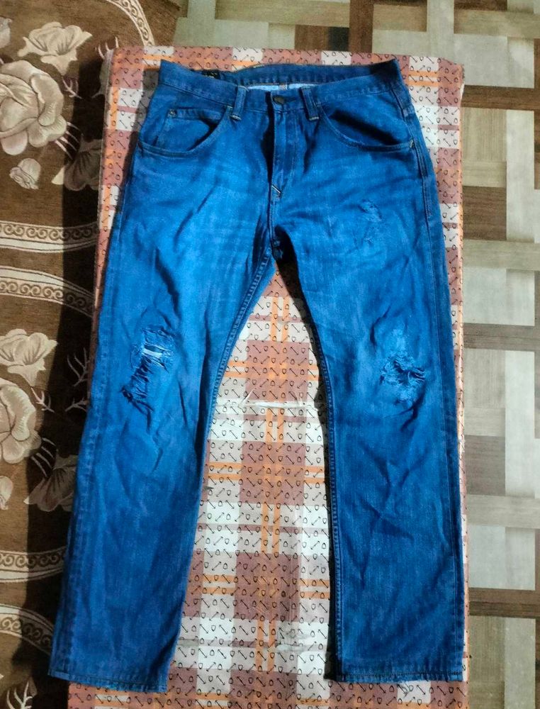 Distressed Blue Denim Jeans