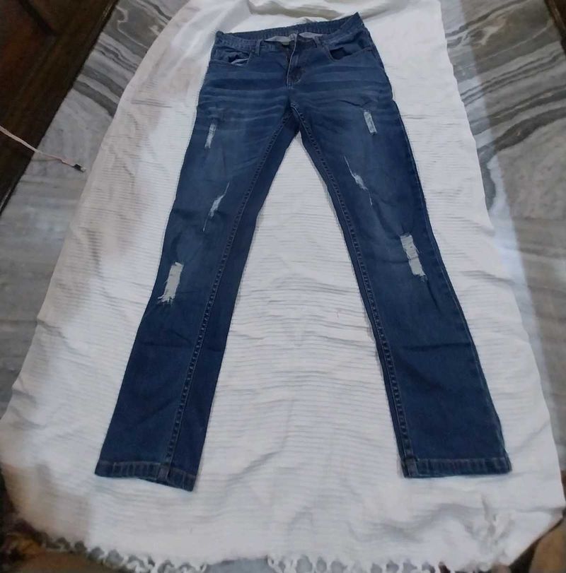 Distressed Blue Denim Jeans