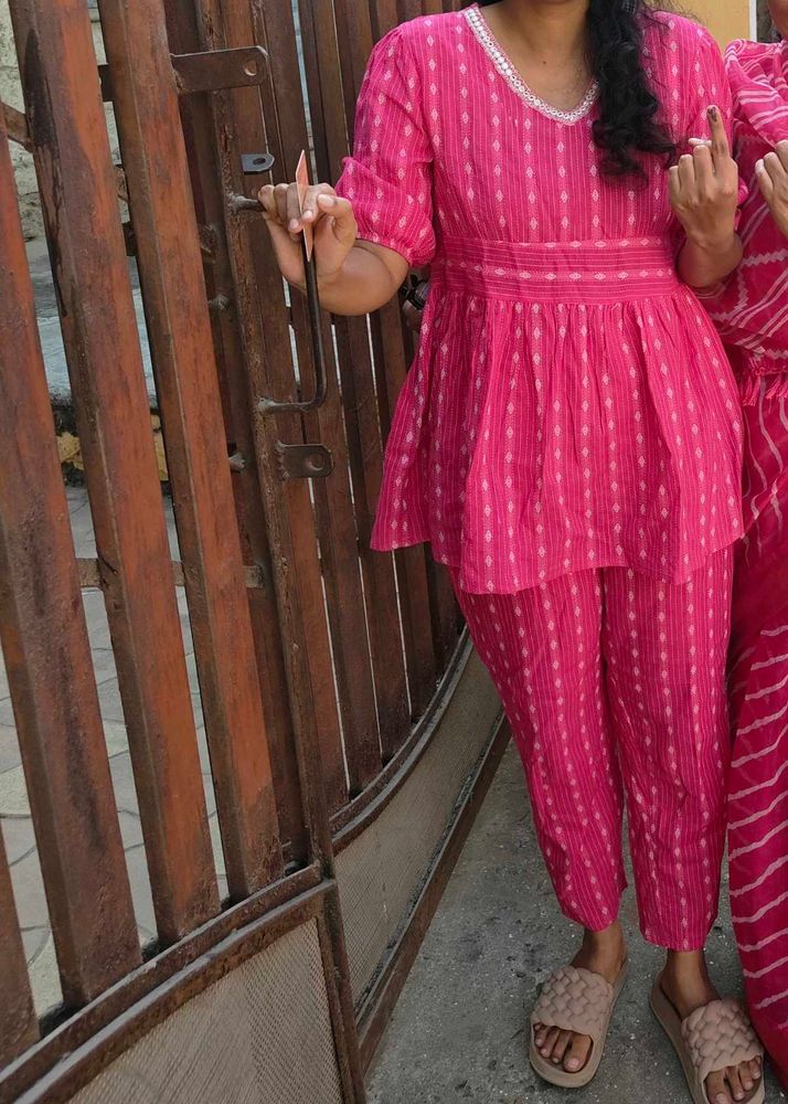 Pink tunic with white details