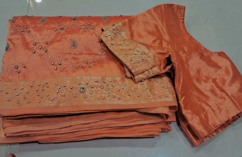 Elegant Peach Saree with stones and breads