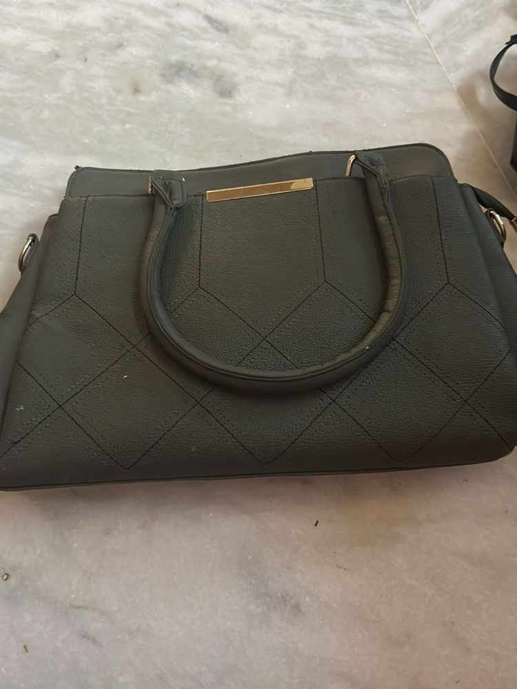 Versatile Dark Quilted Structured Handbag