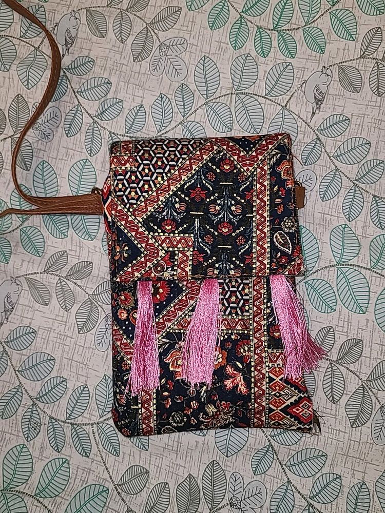 Vibrant Multicolored Sling Bag with Pink Tassels
