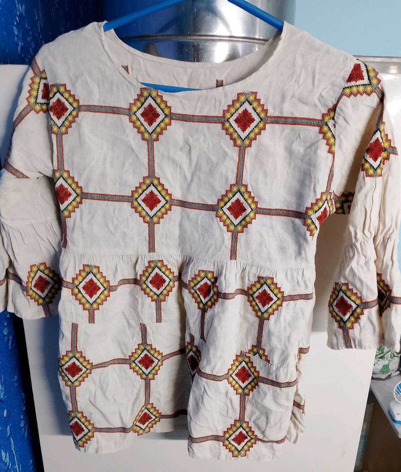 Embroidered Peplum Top