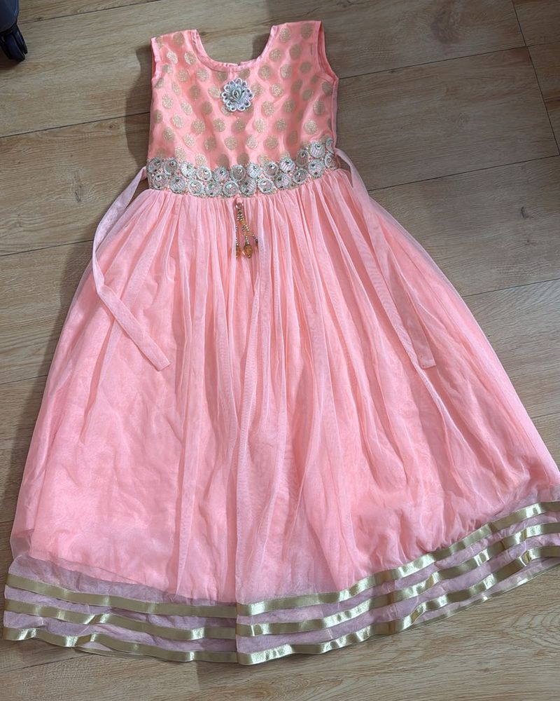 Peach Color Gown In Net For Girls