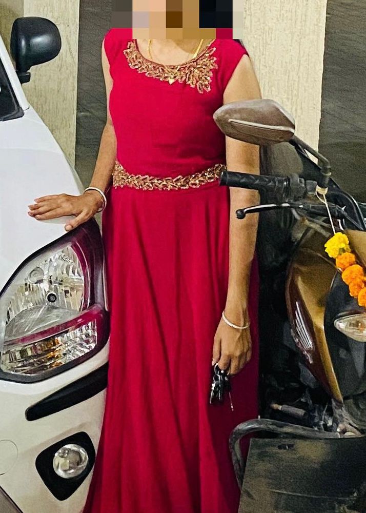 This is Dark Pink colour gown with embroidery