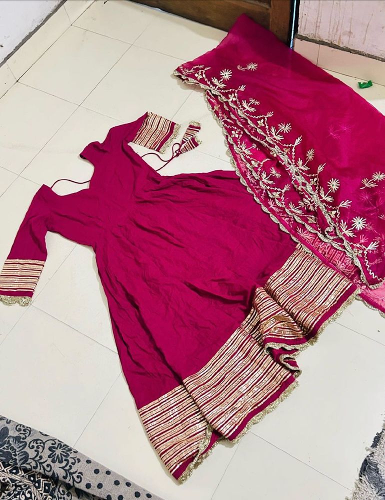 Magentta  anarkalli suit.