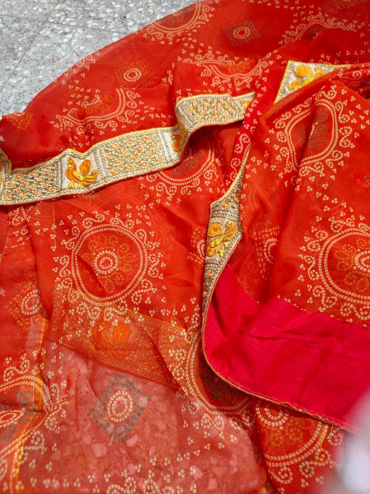 very pretty bandhani orange saree