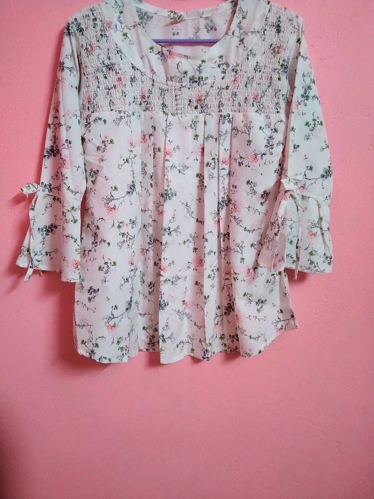 This white dress has beautiful floral designs on