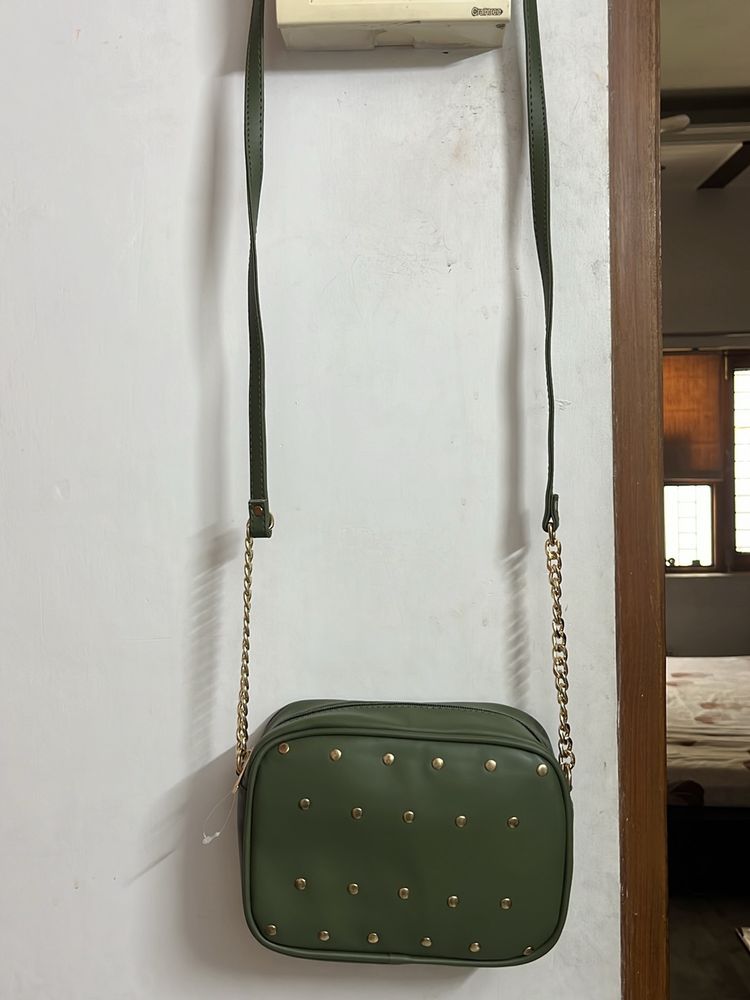 Party Wear Green Sling With Metal Chain Detail