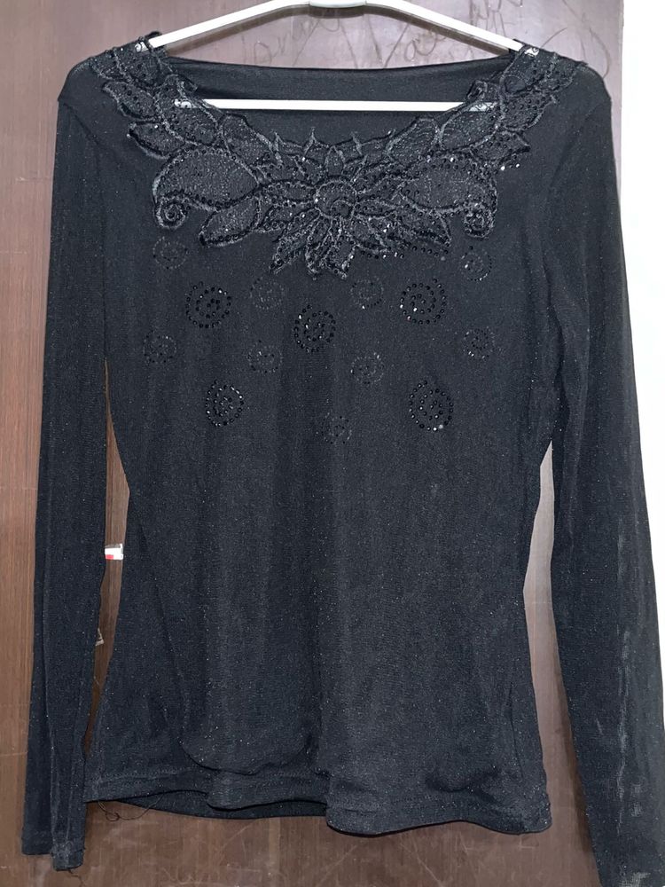 Black top with floral lace on neck
