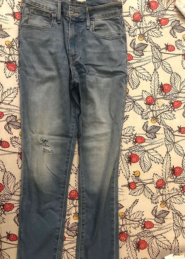 Distressed Light Wash Denim Jeans
