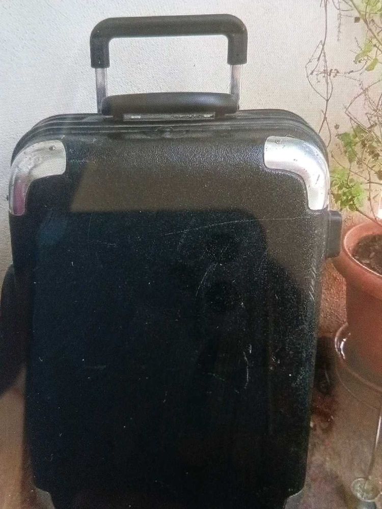 Black suitcase for tourism