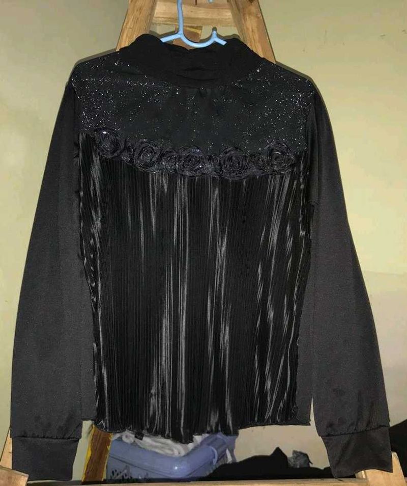 Elegant black pleated top.