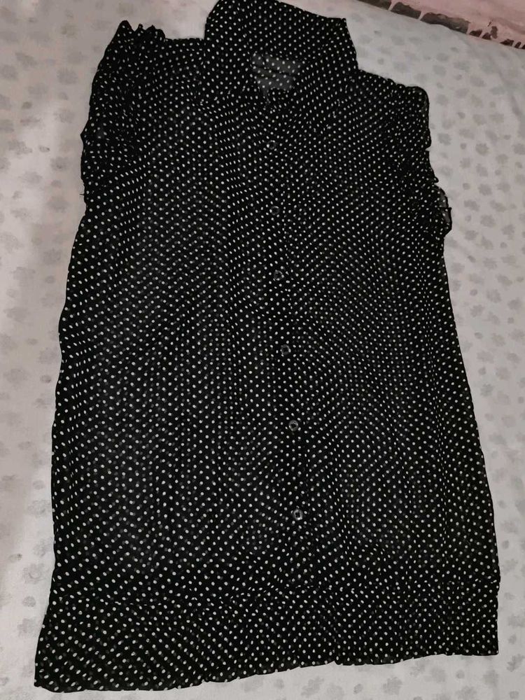 A Black Shirt With White Polka Dot