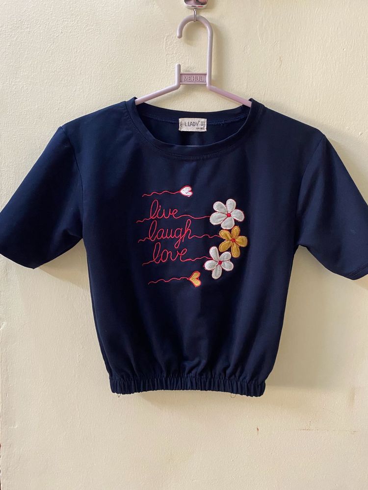 A Navy Blue Top With Flower Embroidery