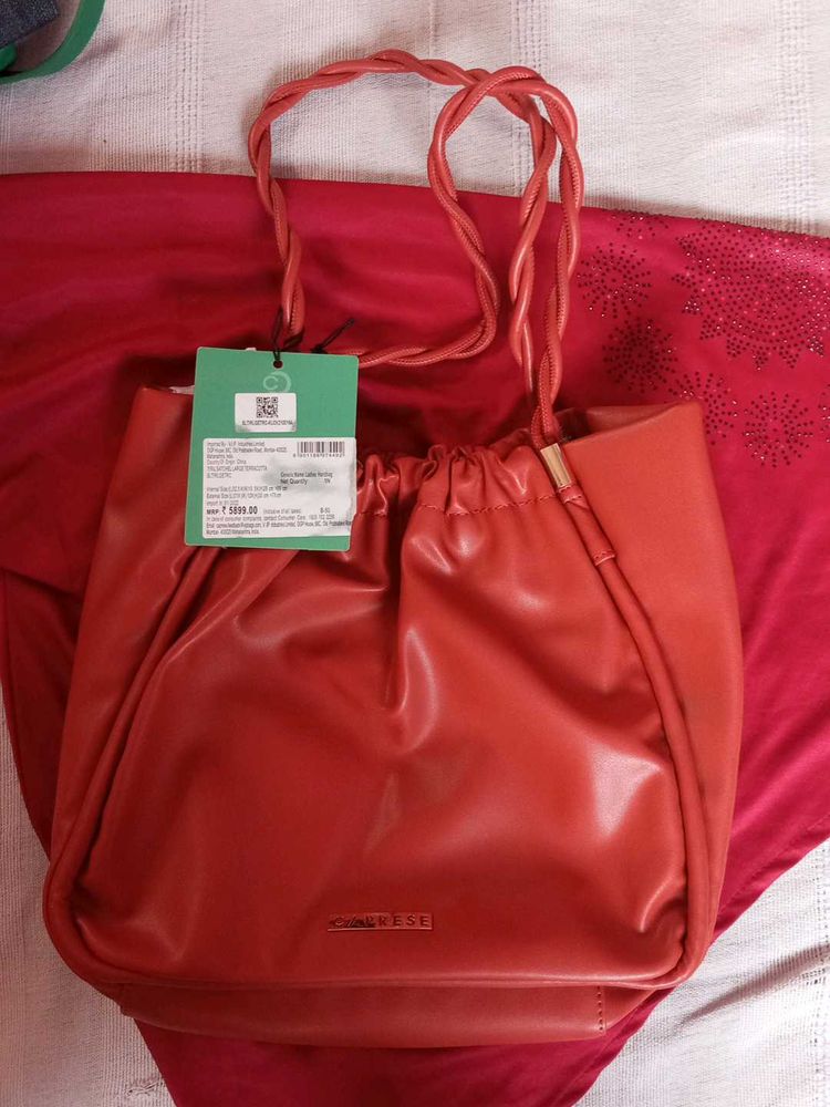 Caprese Orignal Orange Bucket Bag With Metal Accen