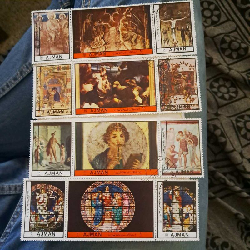 12 Vintage AJMAN painting stamps.