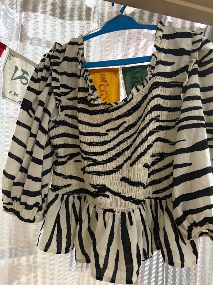 peplum top with puff sleeve