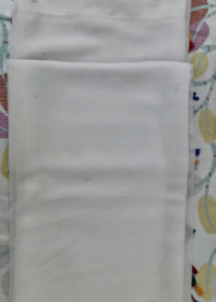 White Saree with multi coloured boarder