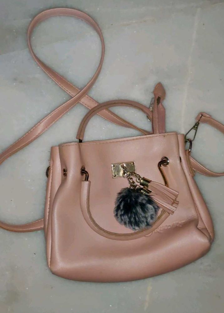 Pink Handbag with Pom Po