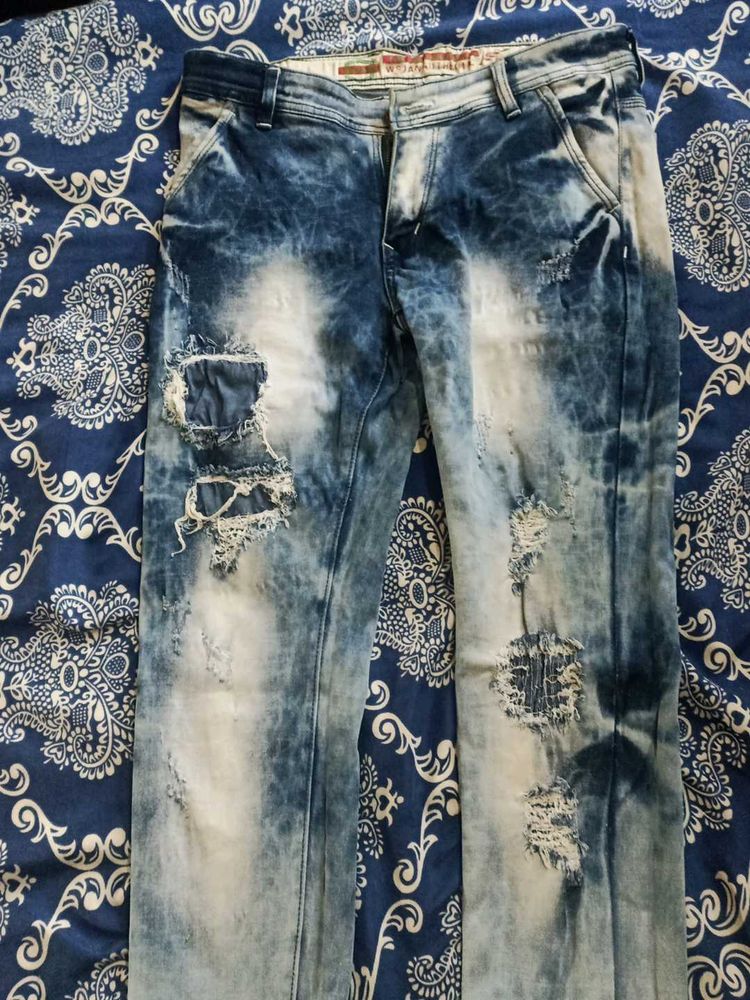 Distressed Blue Denim Jeans