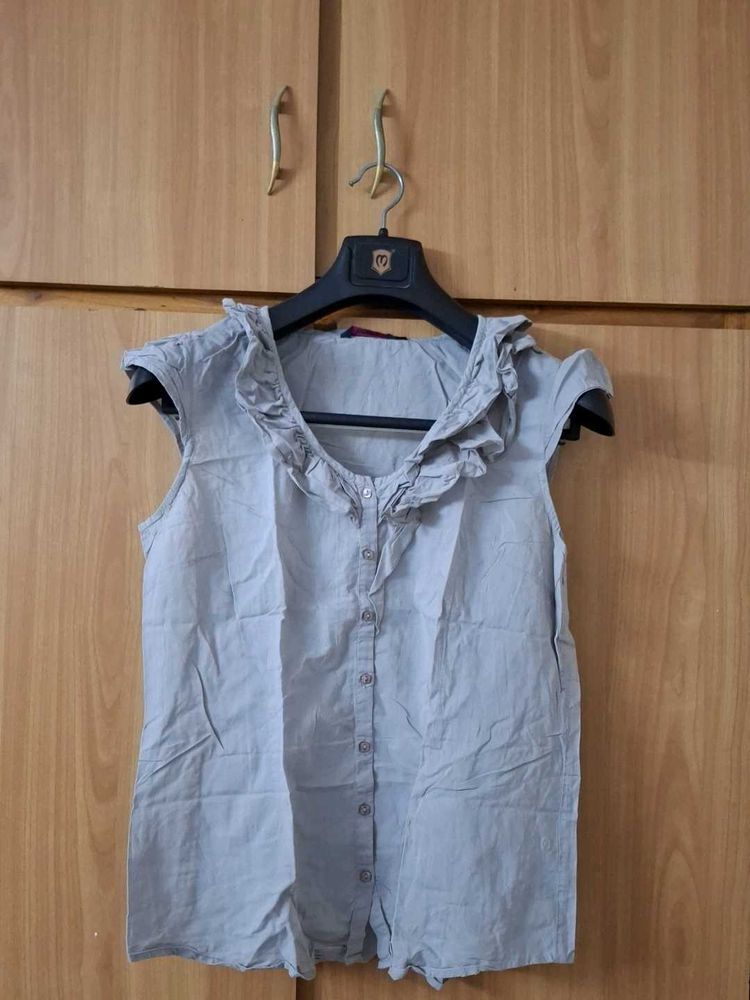 Ruffled Sleeveless Top