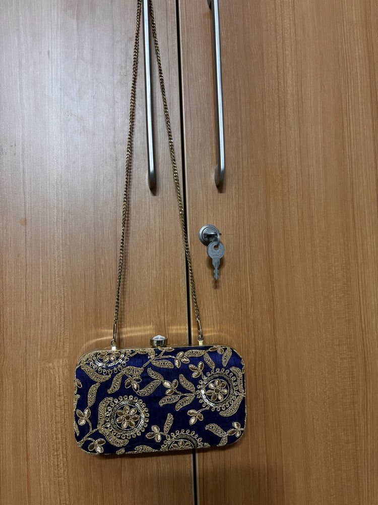 Embroidered box clutch