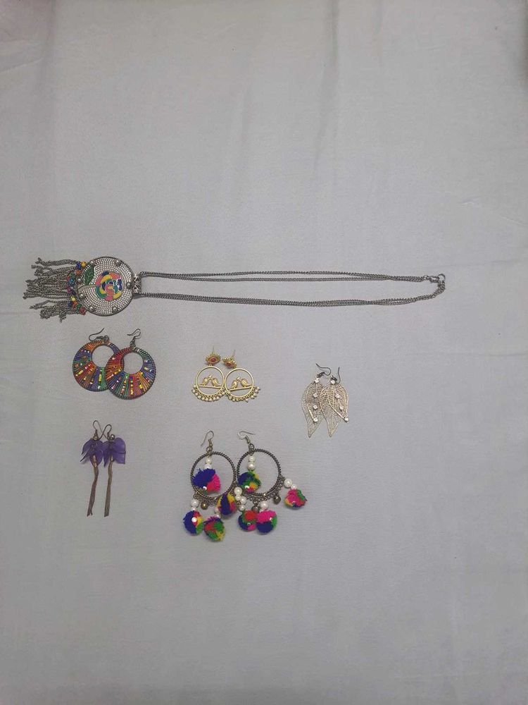 Multiple Pairs Of Earings And One Necklace