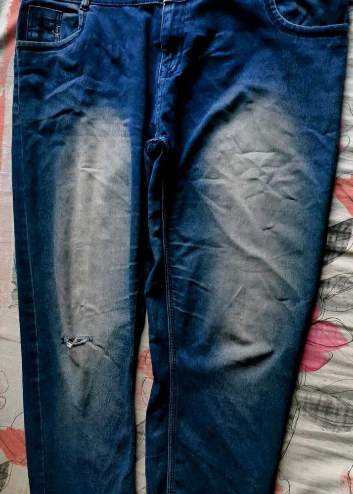 Distressed Blue Denim Jeans