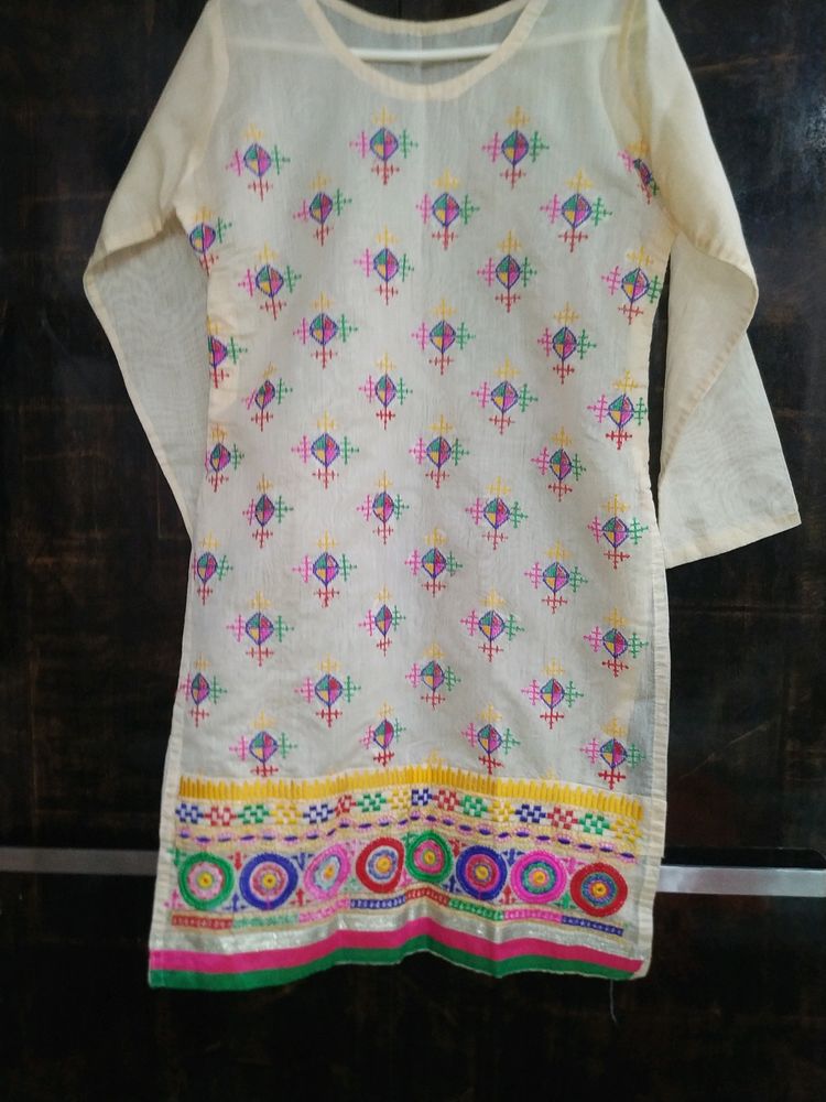 Lovely White Colour Kurti With Beautiful Embroidery Design On It