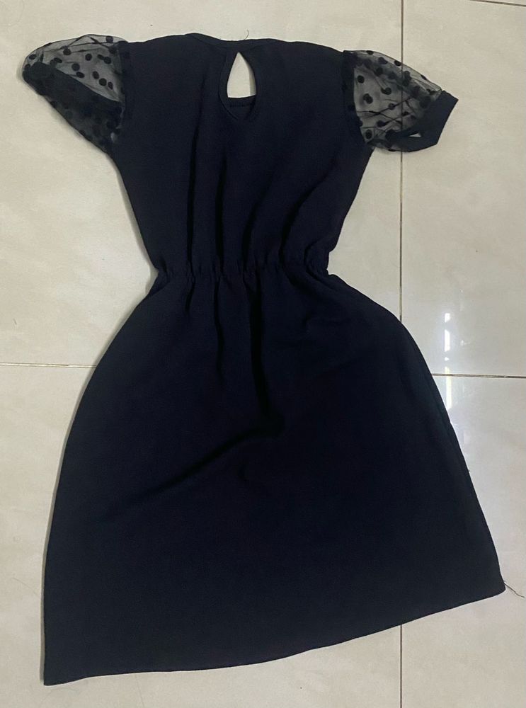 Chic Black Dress with Polka Dot Sleeves