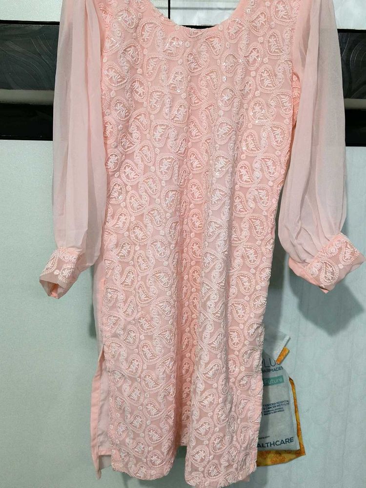 This pink colored georgette Plazo Suit