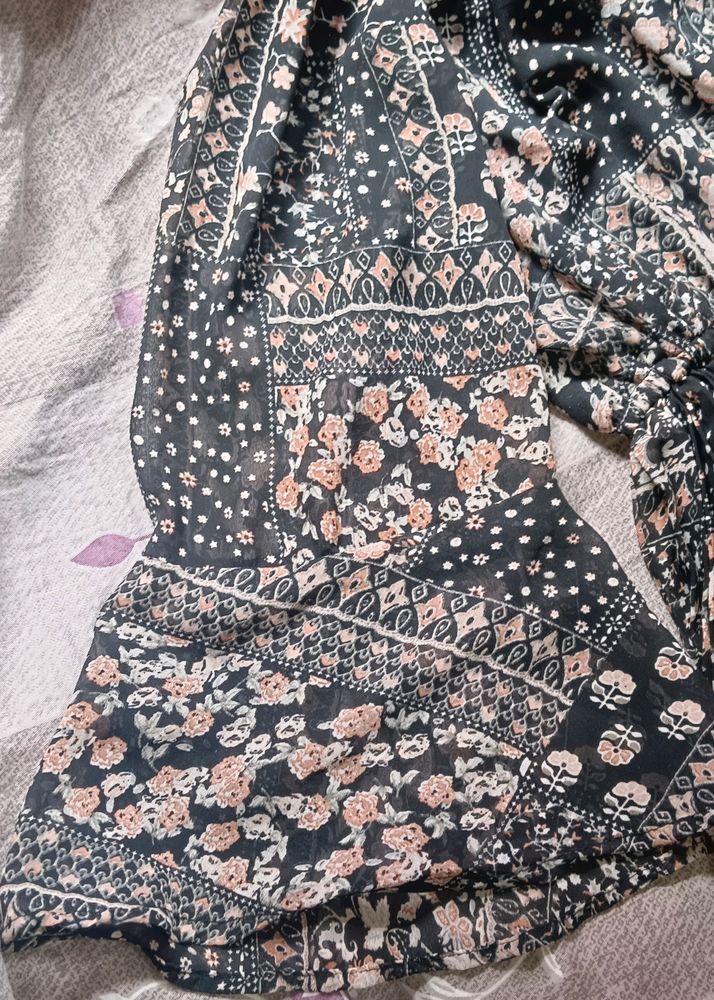 Black ruffle georgette gown.