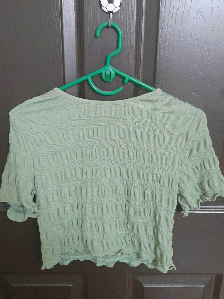 Green Textured Crop Top the size is medium