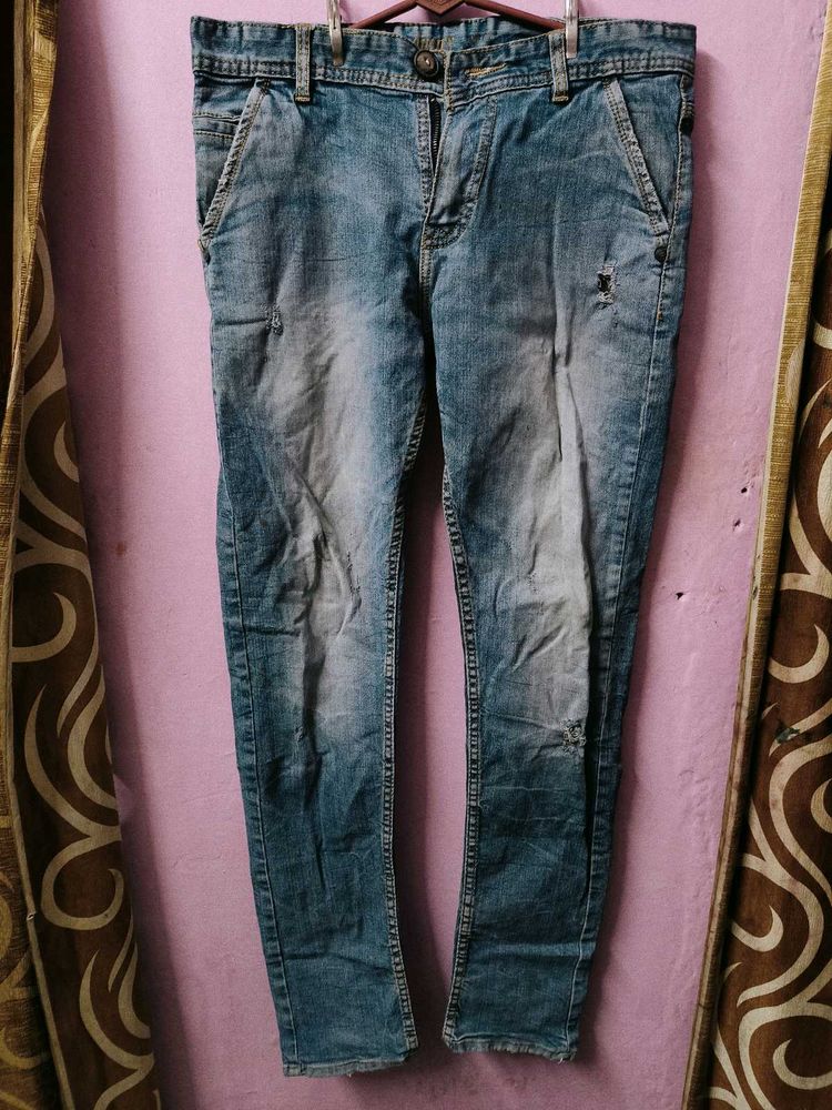 Distressed Blue Denim Jeans