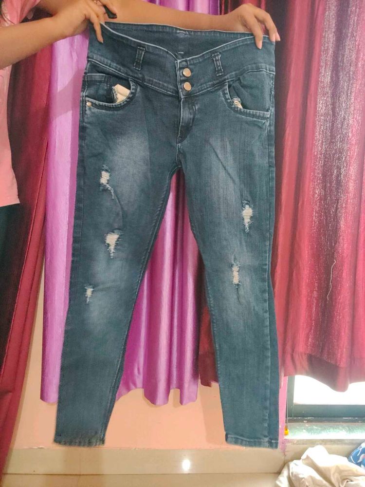 Ripped High-Waisted Denim Jeans