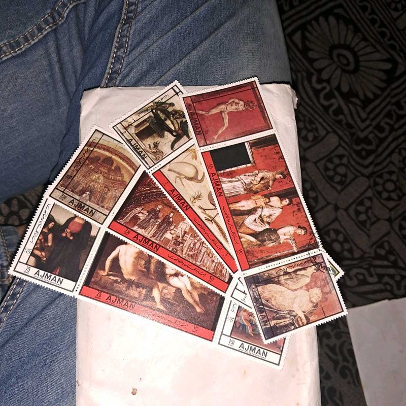 12 Vintage AJMAN painting stamps.