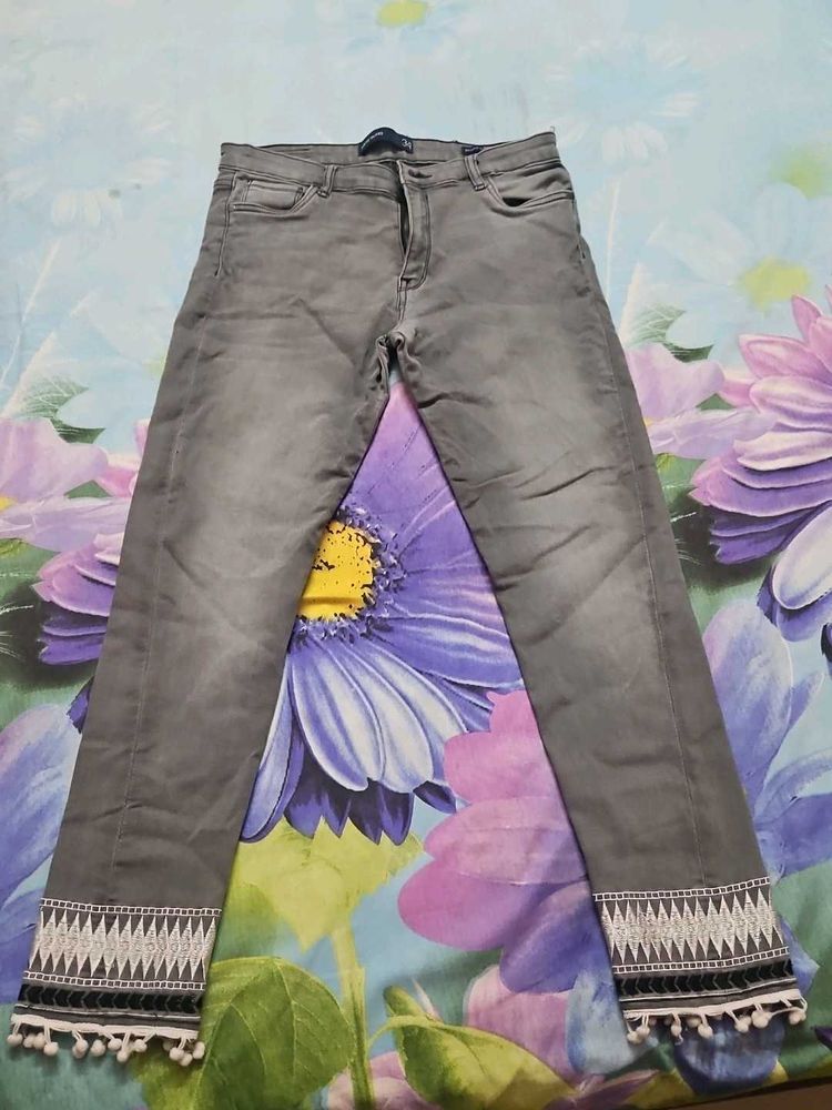 Gray Denim Jeans with Pom-Pom Detail