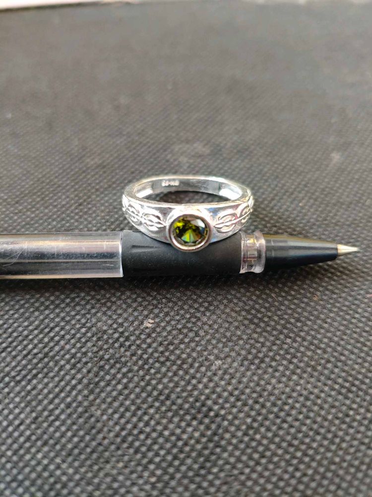 Pure silver ring with green zircon stone.