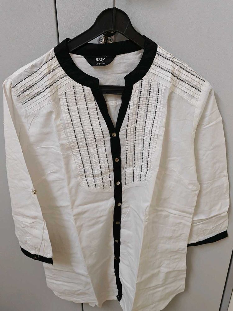 Elegant White Top with Black Trim