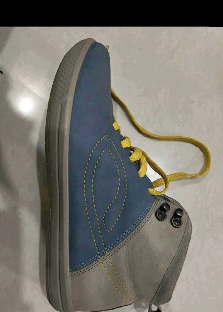 Blue and gray high top shoes