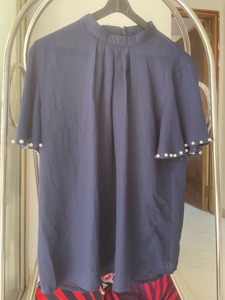 Elegant Navy Top with Pearl Details