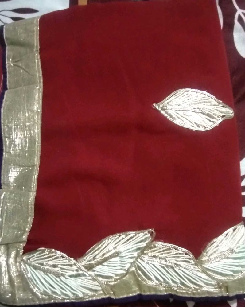 Elegant Maroon Saree with Silver Details