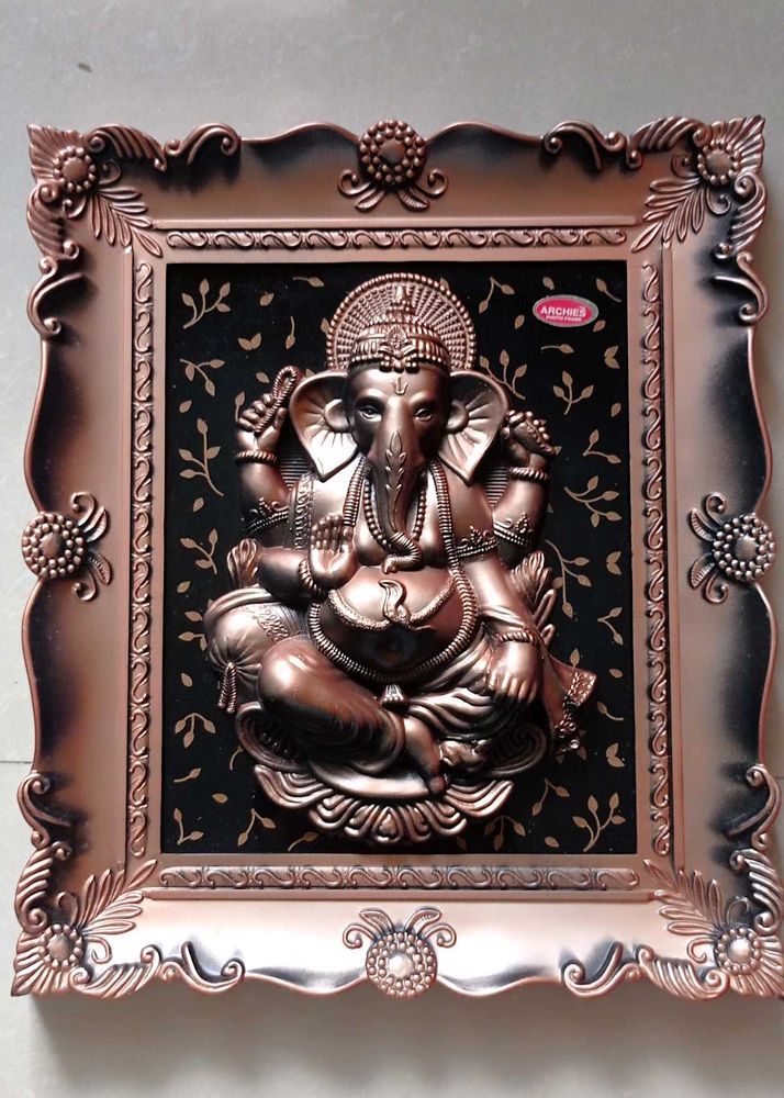 Divine Ganesha Idol in Ornate Frame