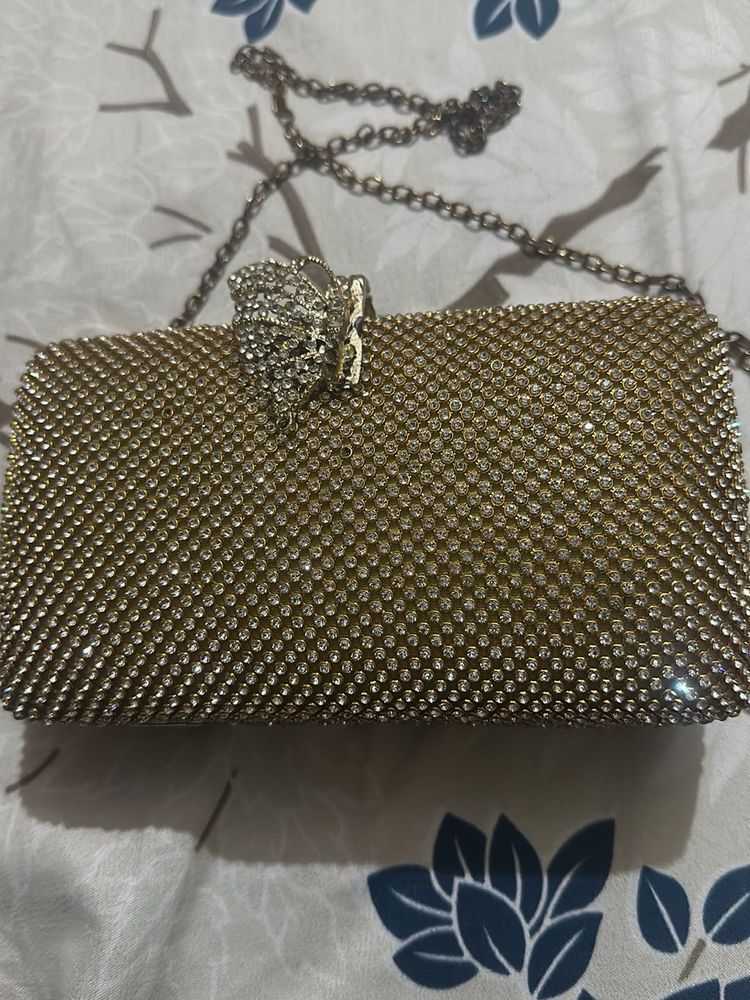 Elegant Gold Clutch with Chain