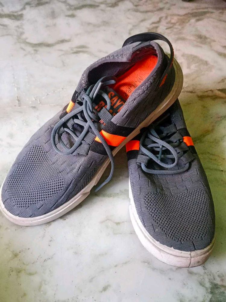 Gray and orange sneakers Ladies